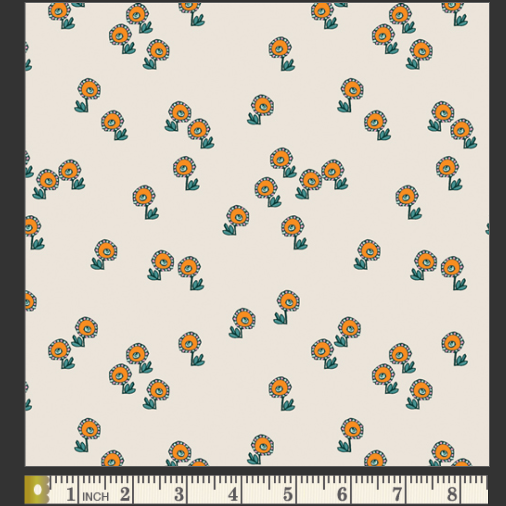 Pattern of small orange flowers with green stems on a beige background, with a ruler at the bottom for scale.