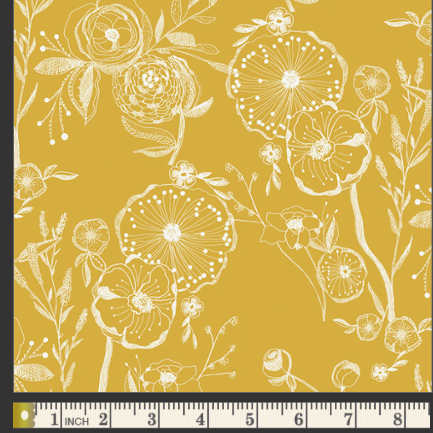 Floral pattern on a mustard yellow background with a ruler at the bottom.