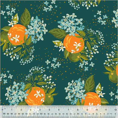 Pattern of oranges and flowers on a teal background with a ruler at the bottom.