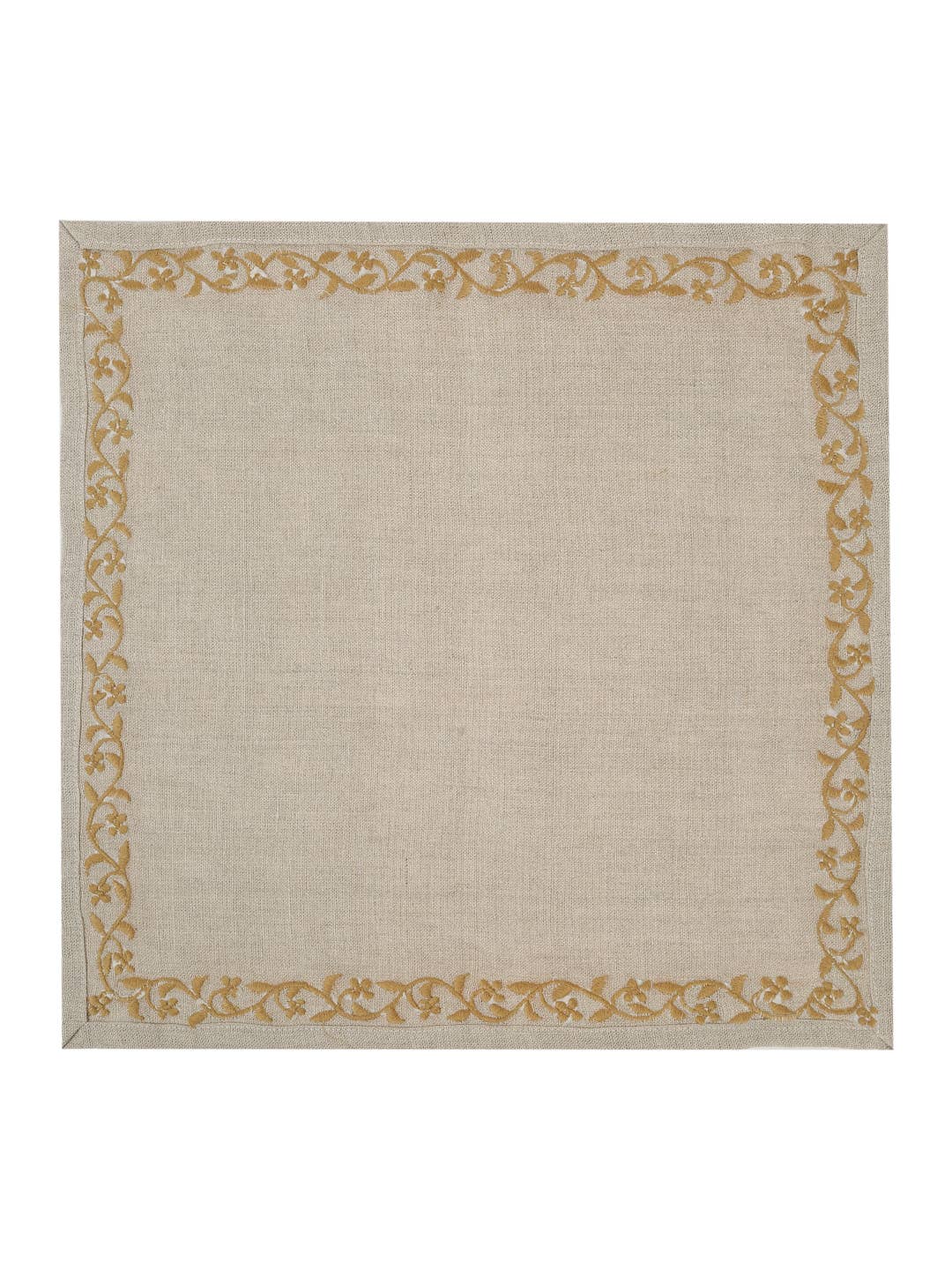 The backside of a square beige napkin with a textured linen-like surface and a decorative border featuring a repeating gold floral and vine pattern, shown flat against a white background.