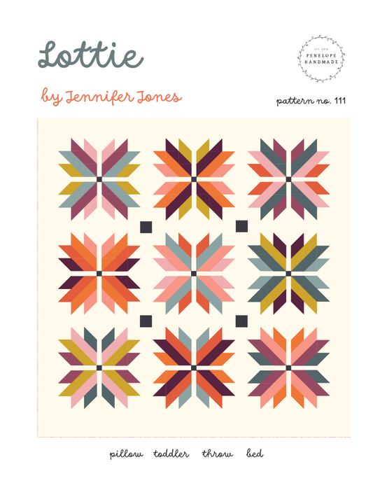 Quilt pattern cover with geometric star designs and 'Lottie' branding.