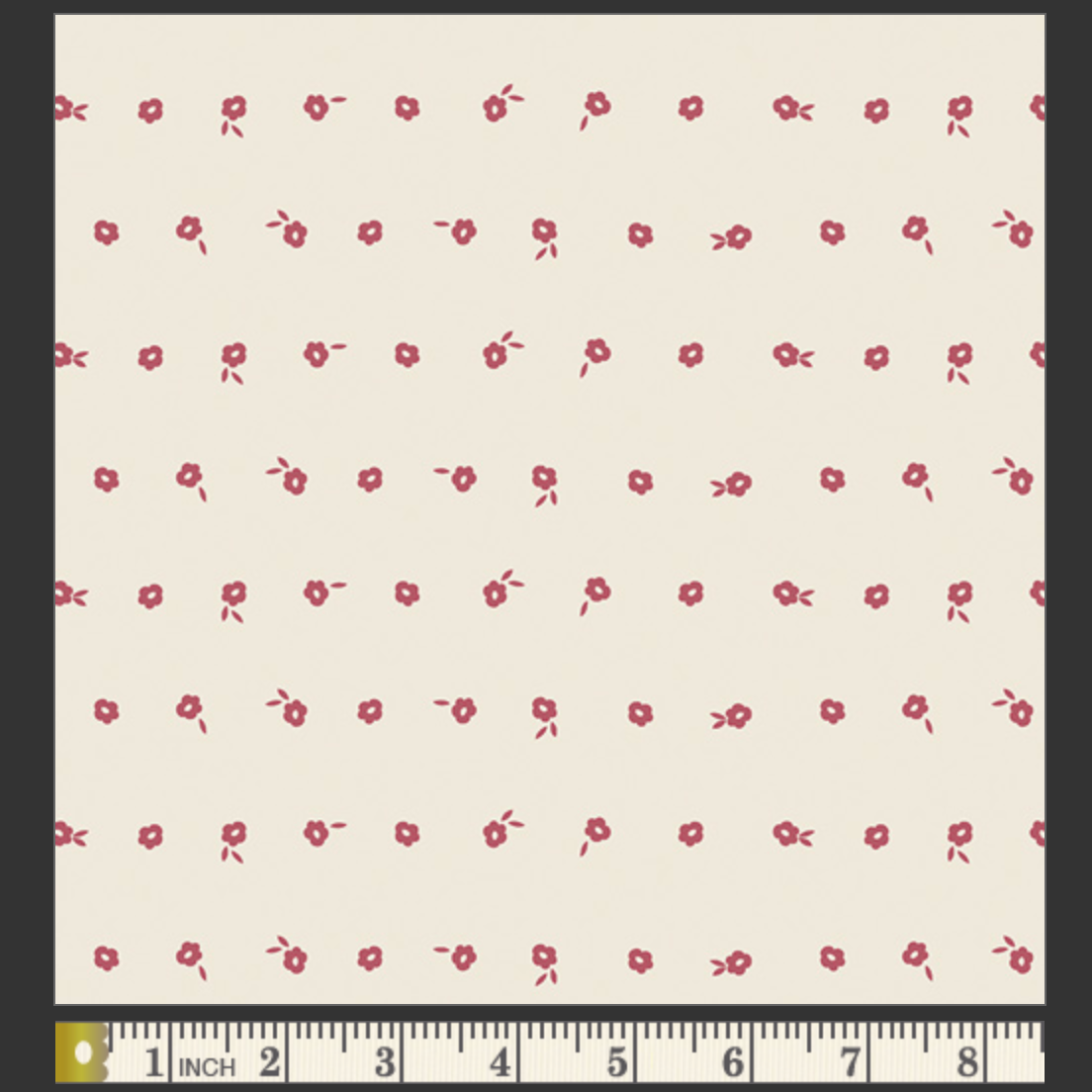 White fabric with red floral pattern and ruler at the bottom for scale.