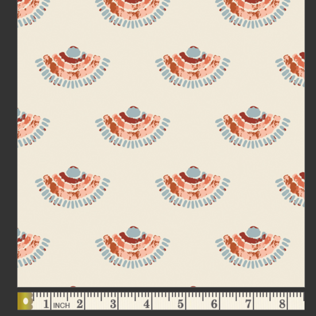 Patterned fabric swatch with a ruler at the bottom