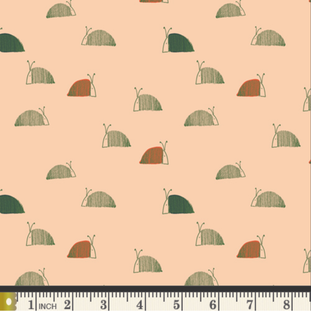 Pattern of small snail illustrations on a beige background with a ruler at the bottom.