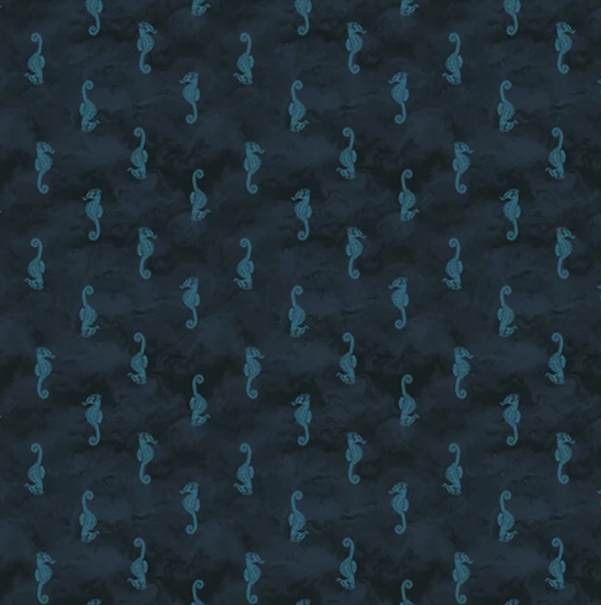 Dark navy blue fabric with a repeating pattern of small teal seahorses, shown flat with a white ruler along the bottom edge for scale.