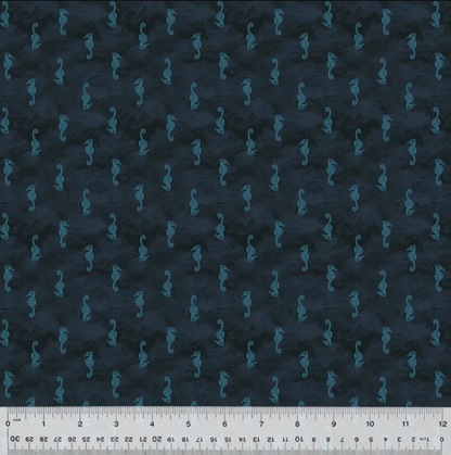 Dark navy blue fabric with a repeating pattern of small teal seahorses, shown flat with a white ruler along the bottom edge for scale.