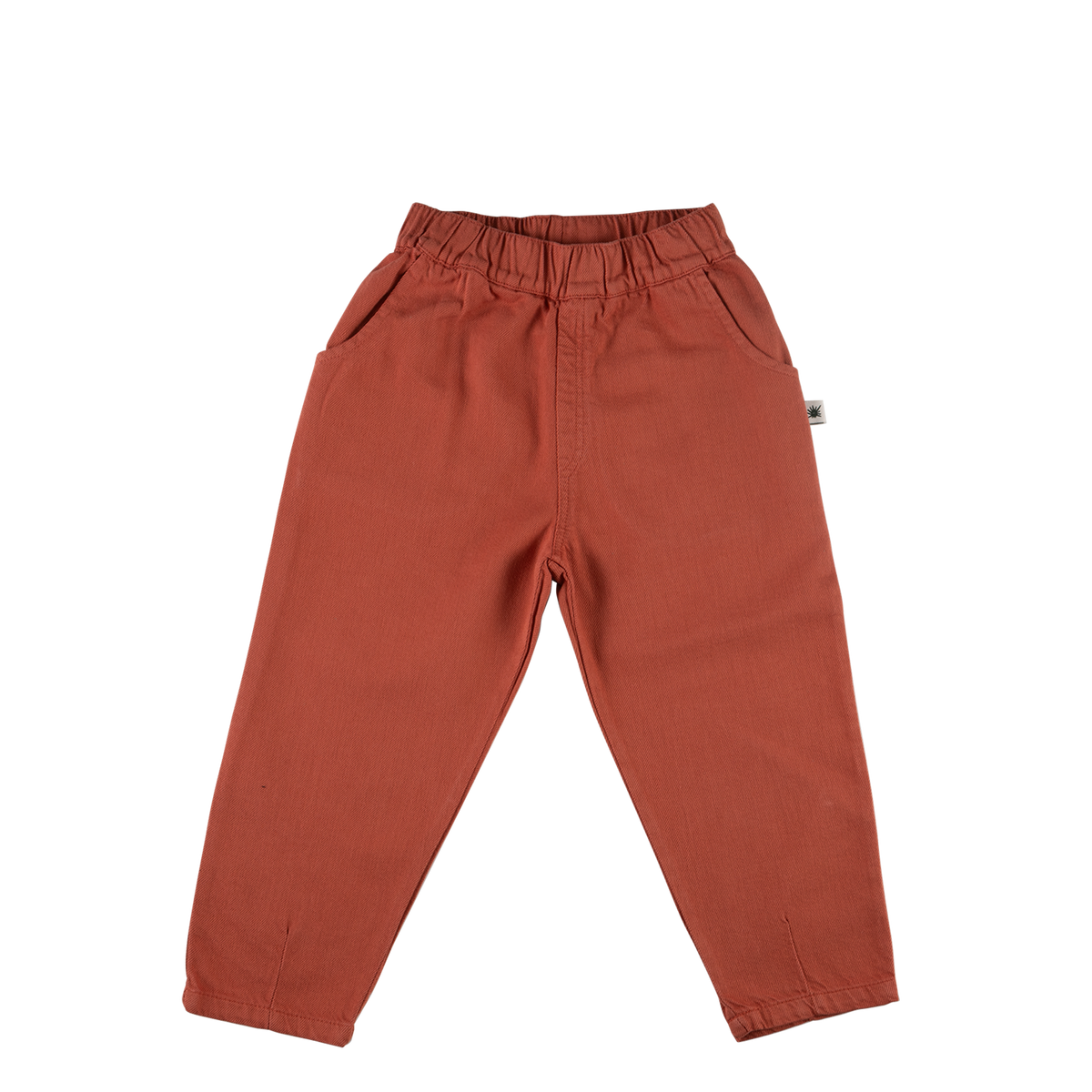 A pair of toddler's wide-leg pants in a terracotta rust color, featuring an elastic waistband and side pockets, laid flat on a white background.
